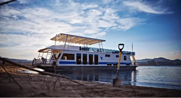 houseboat docked at a beach