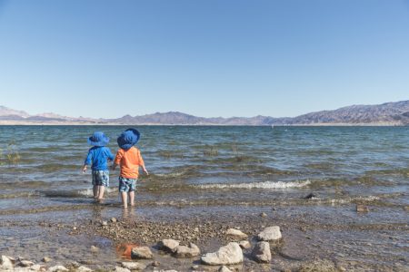 Identical Twin Brothers having fun on the shores of Lake Mead, Nevada.