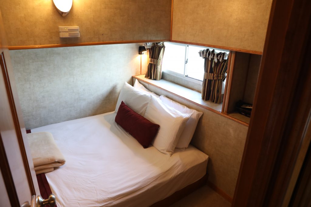 large houseboat room with queen size bed