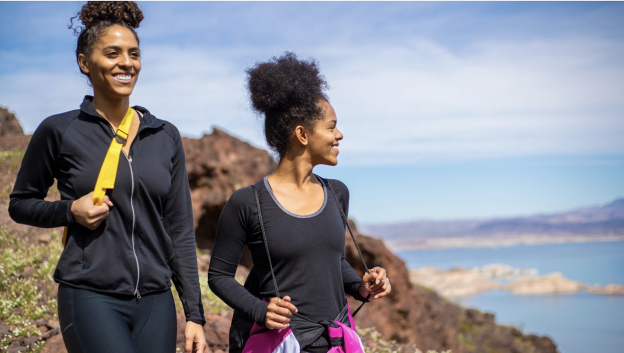 Two women on a hike along the water